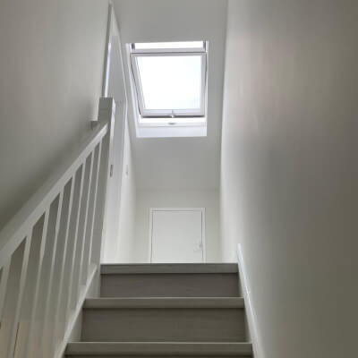 Dark wood staircase for attic living room